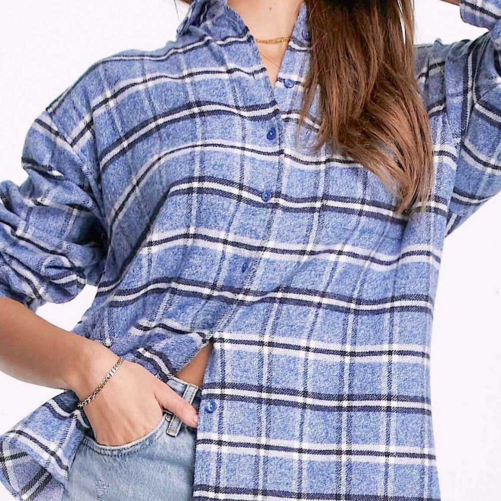 Oversized shacket with dip hem pocket in navy and blue check.